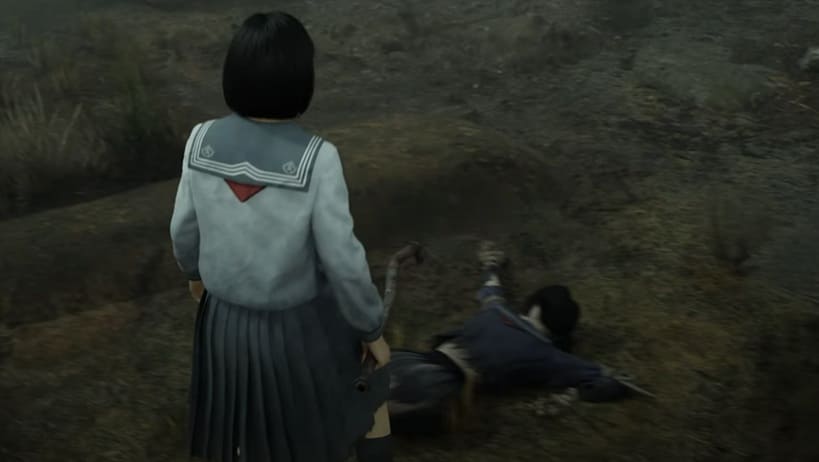 Die tote weibliche Vogelscheuche der 5. Gruppe, die auf dem Boden liegt und euch die richtige Richtung weist